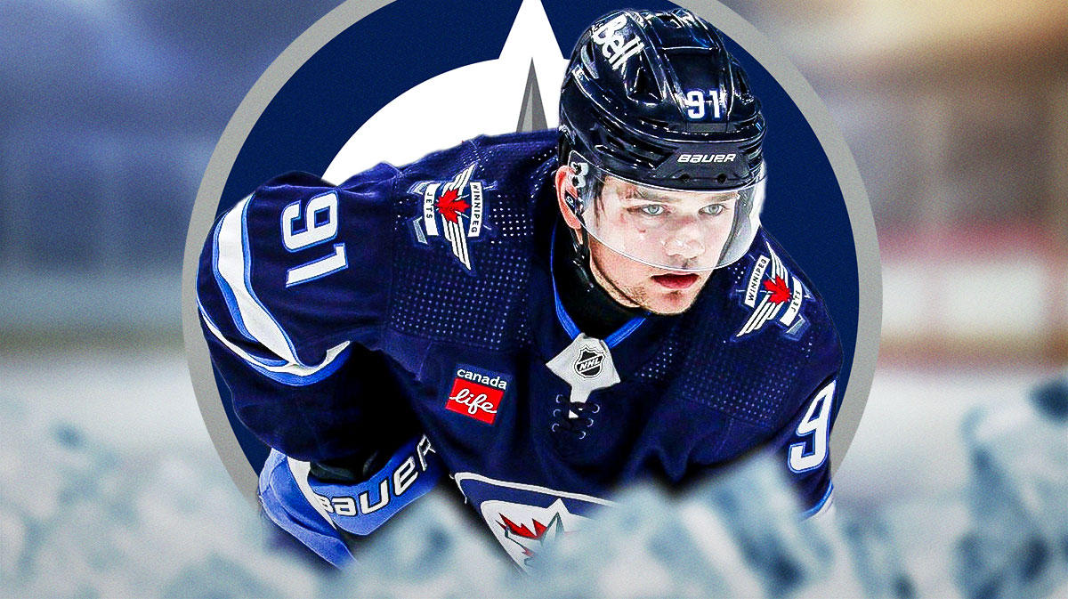 Jets right wing Cole Perfetti next to the Winnipeg Jets logo with a hockey rink in the background