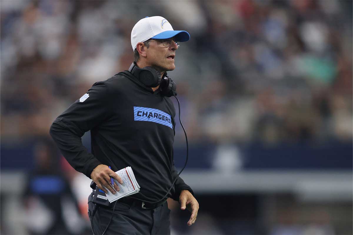 Los Angeles Chargers head coach Jim Harbaugh on the field in the second quarter against the Dallas Cowboys at AT&T Stadium.