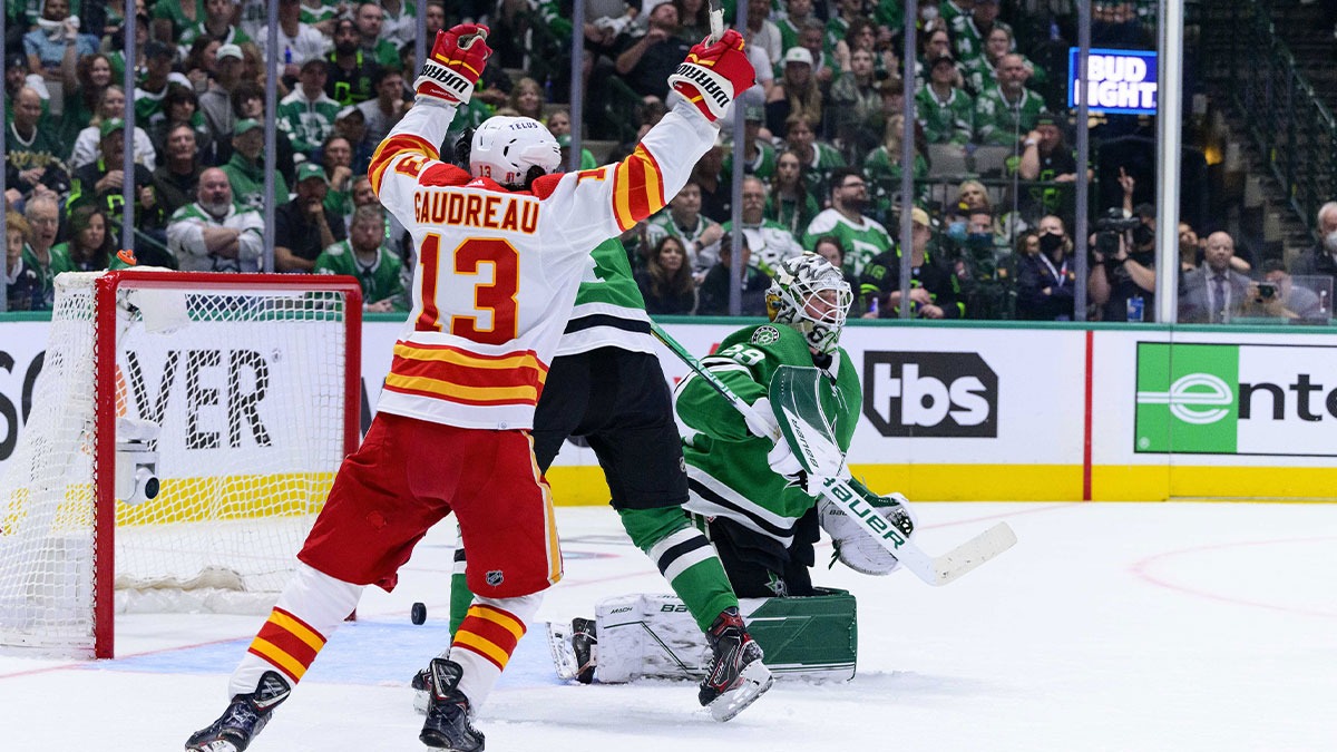 Calgary Flames left wing Johnny Gaudreau (13) celebrates a power play goal scored by defenseman Rasmus Andersson (not pictured) against Dallas Stars goaltender Jake Oettinger (29) during the second period in game four of the first round of the 2022 Stanley Cup Playoffs at American Airlines Center.