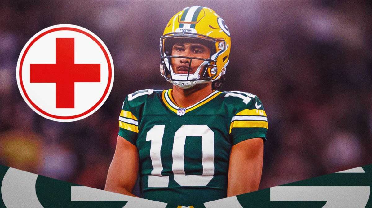 Jordan Love in a Green Bay Packers uniform with a red and white first aid symbol as he's still injured and likely out for week three with injury as the packers start malik willis at quarterback.