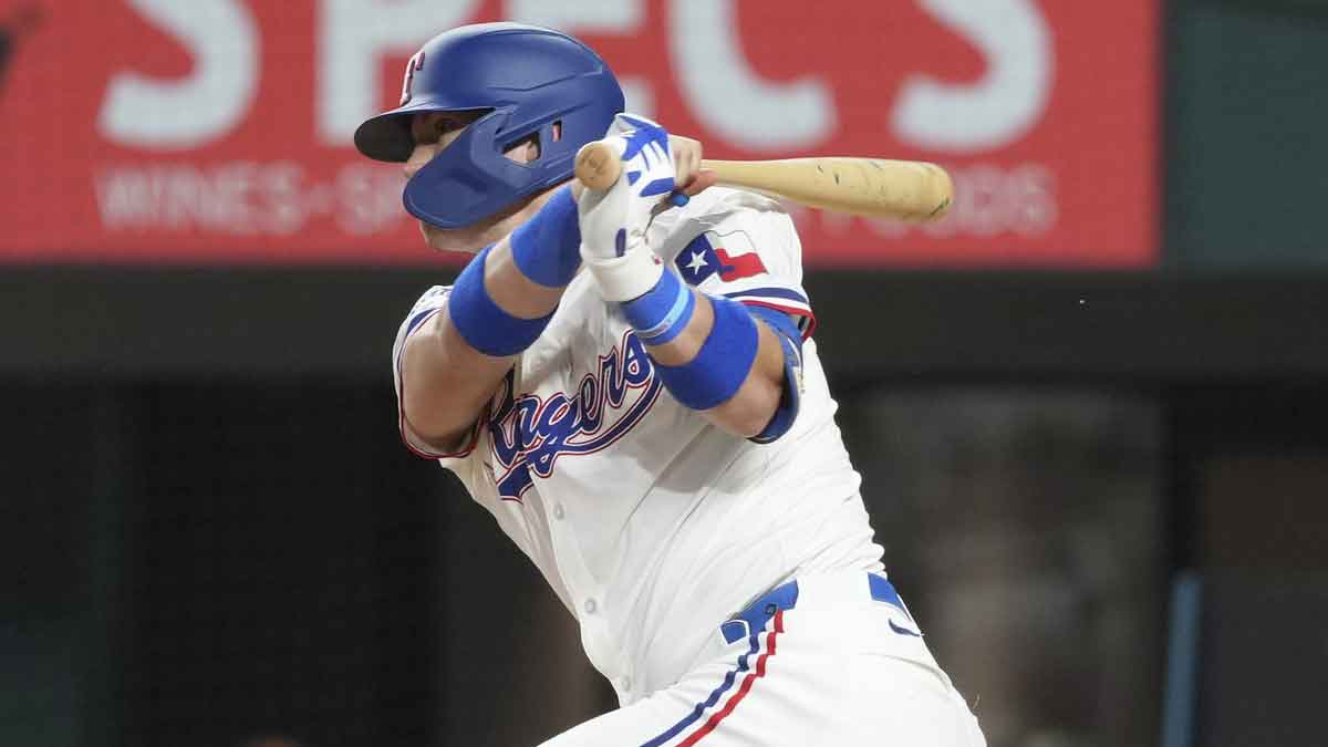Sep 7, 2024; Arlington, Texas, USA; Texas Rangers third baseman Josh Jung (6) follows through on his single against the Los Angeles Angels during the sixth inning at Globe Life Field.