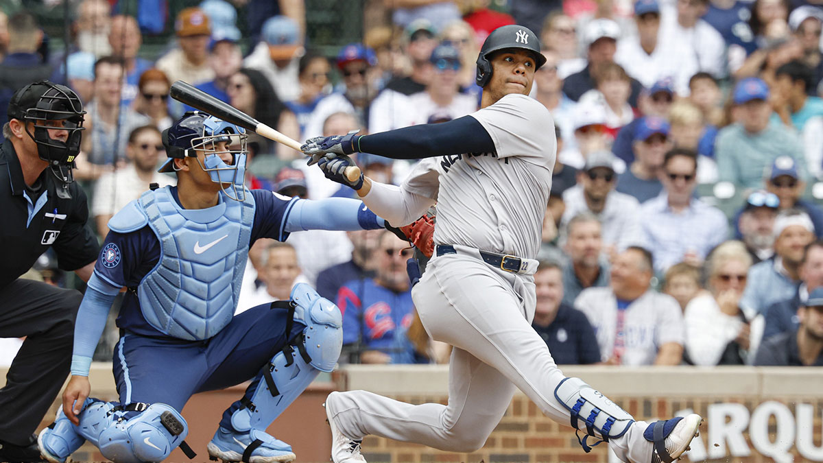 New York Yankees outfielder Juan Soto (22) singles against the Chicago Cubs during the third inning at Wrigley Field.