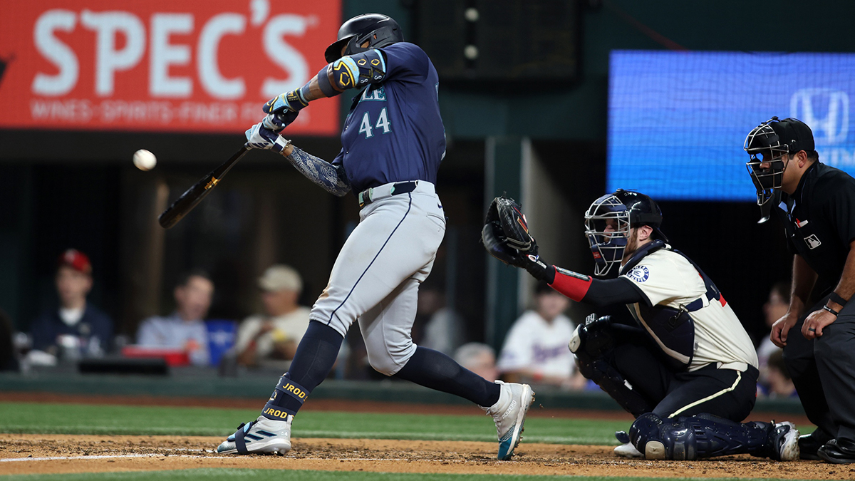 Sep 20, 2024; Arlington, Texas, USA; Seattle Mariners center fielder Julio Rodriguez (44) hits a three-run home run against the Texas Rangers in the fifth inning at Globe Life Field.