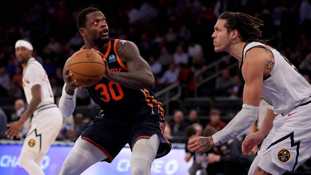 Jan 25, 2024; New York, New York, USA; New York Knicks forward Julius Randle (30) looks to shoot the ball against Denver Nuggets forward Aaron Gordon (50) during the third quarter at Madison Square Garden.