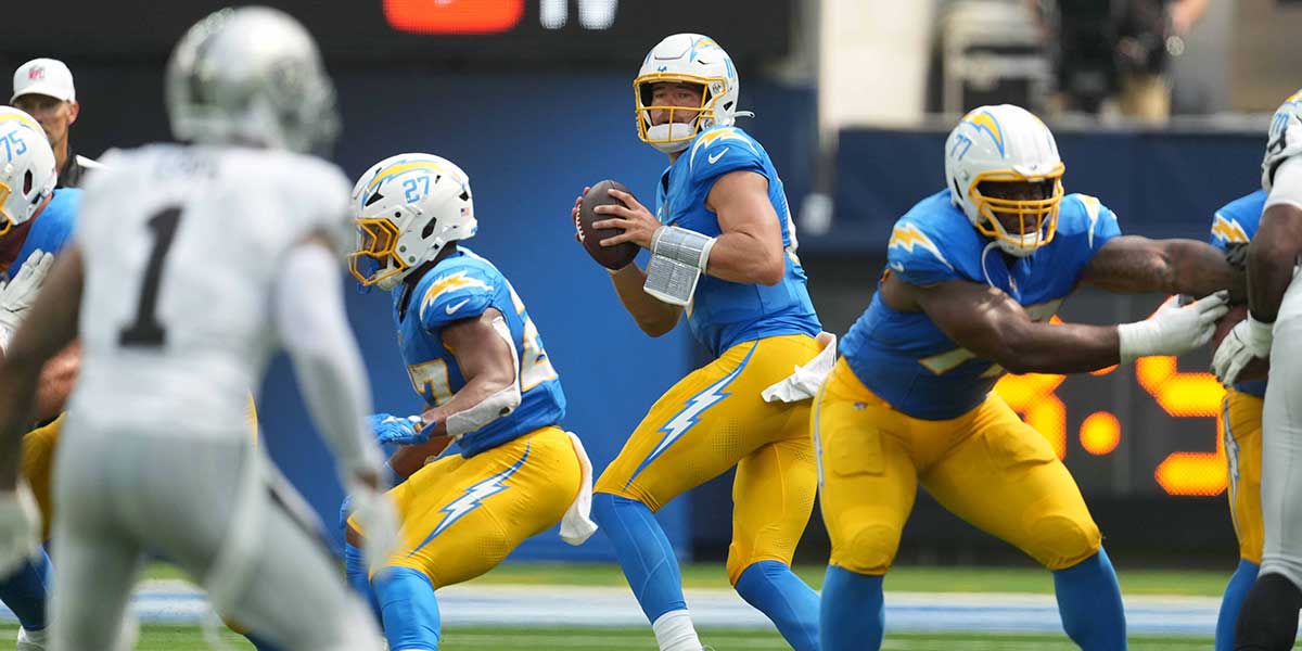 Los Angeles Chargers quarterback Justin Herbert (10) throws the ball against the Las Vegas Raiders in the first half at SoFi Stadium.