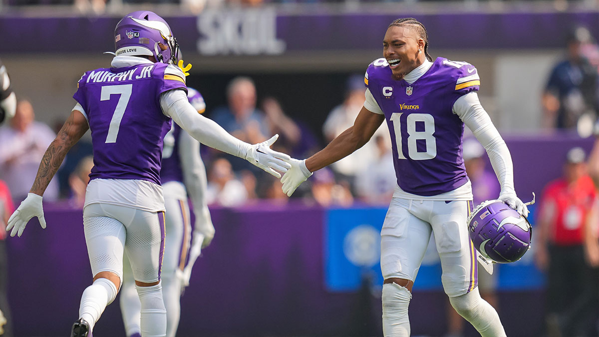 Minnesota Vikings wide receiver Justin Jefferson (18) celebrates an interception with cornerback Byron Murphy Jr. (7) against the San Francisco 49ers in the third quarter at U.S. Bank Stadium.