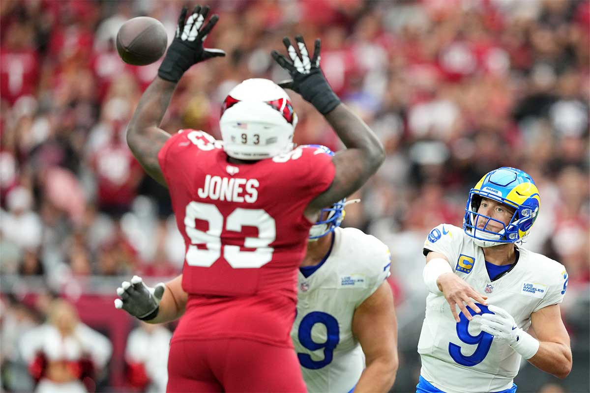 Los Angeles Rams quarterback Matthew Stafford (9) throws over Arizona Cardinals defensive tackle Justin Jones (93) during the first half at State Farm Stadium.