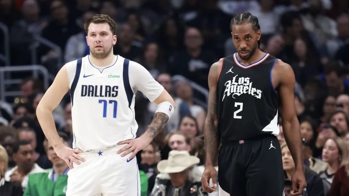 Dallas Mavericks guard Luka Doncic (77) and Los Angeles Clippers forward Kawhi Leonard (2) stand on the floor during the first quarter of game two of the first round for the 2024 NBA playoffs at Crypto.com Arena.