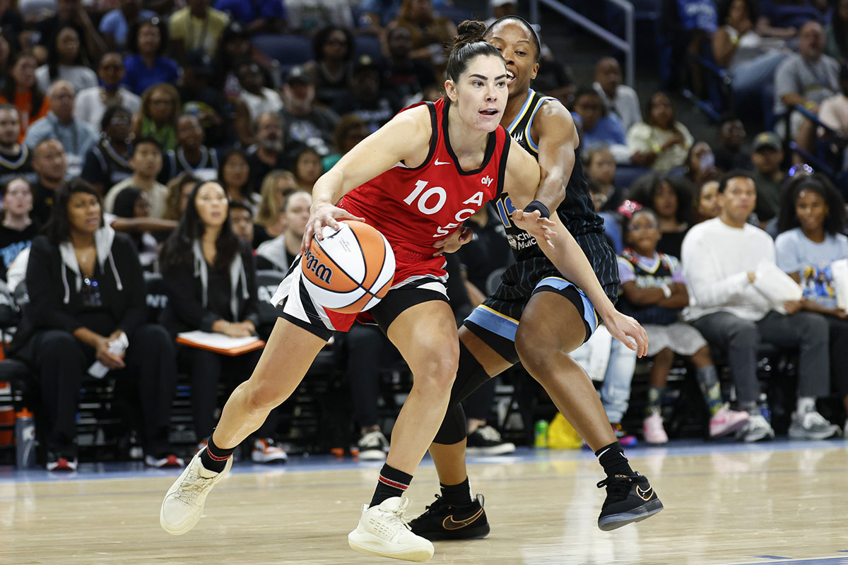 Las Vegas Aces guard Kelsey Plum (10) drives to the basket against Chicago Sky guard Lindsay Allen (15) during the second half at Wintrust Arena.