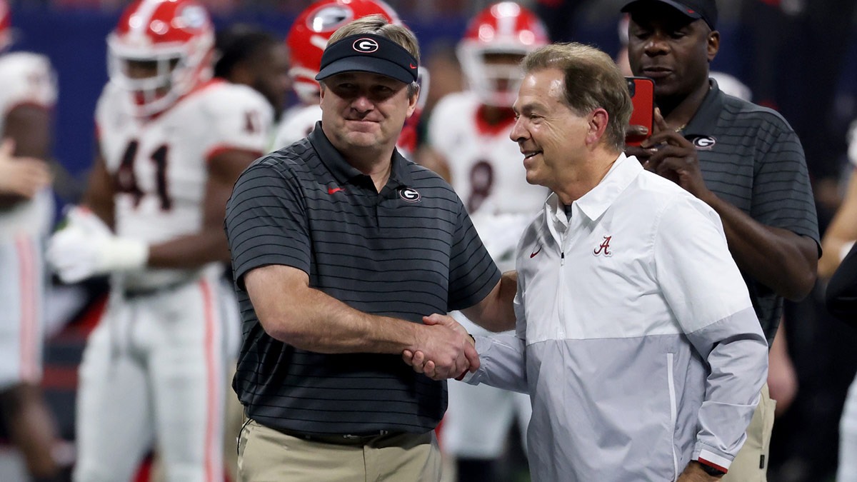 Georgia Bulldogs head coach Kirby Smart greets Alabama Crimson Tide head coach Nick Saban before the SEC championship game at Mercedes-Benz Stadium.