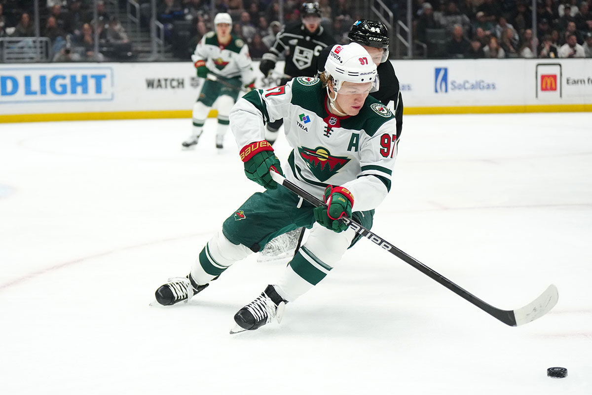 Minnesota Wild left wing Kirill Kaprizov (97) pursues the puck against LA Kings defenseman Mikey Anderson (44) in the first period at Crypto.com Arena.