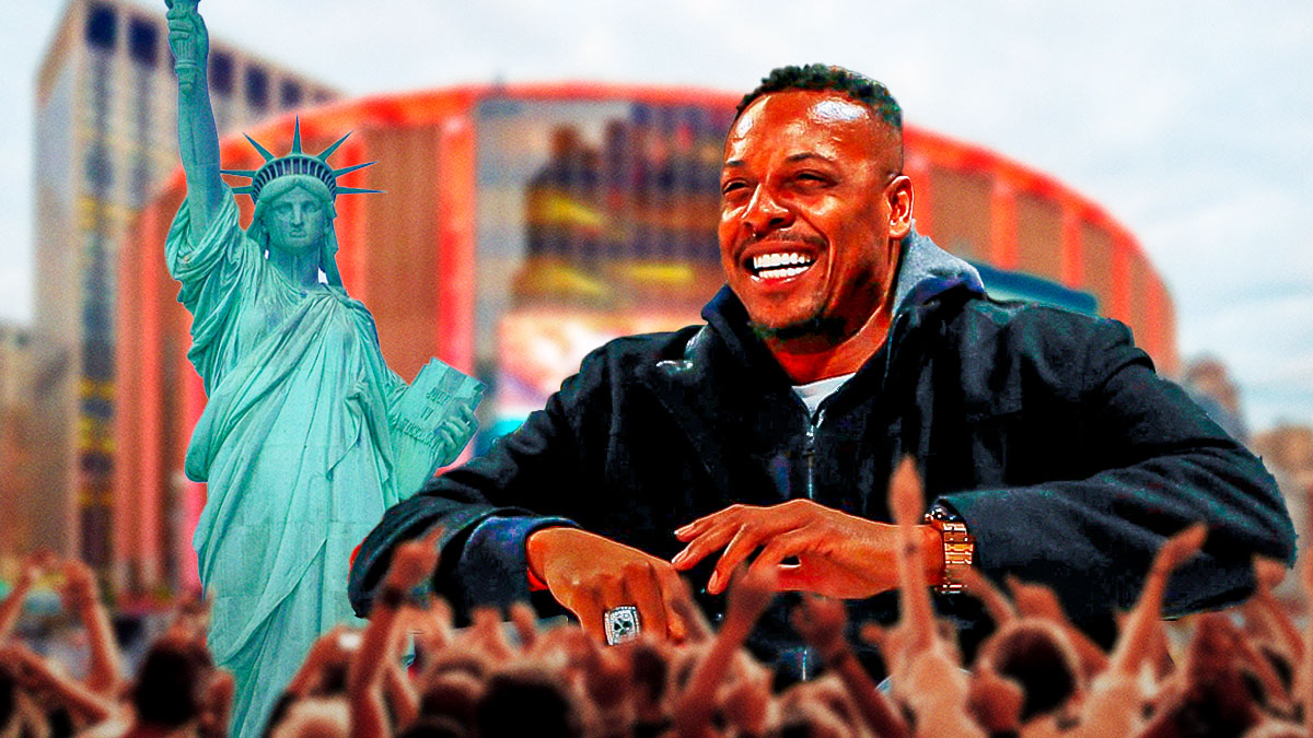 Paul Pierce laughing next to a group of Knicks fans & the Statue of Liberty with Madison Square Garden in the background