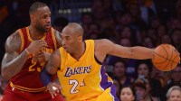 LeBron James (23) guards Los Angeles Lakers forward Kobe Bryant (24)