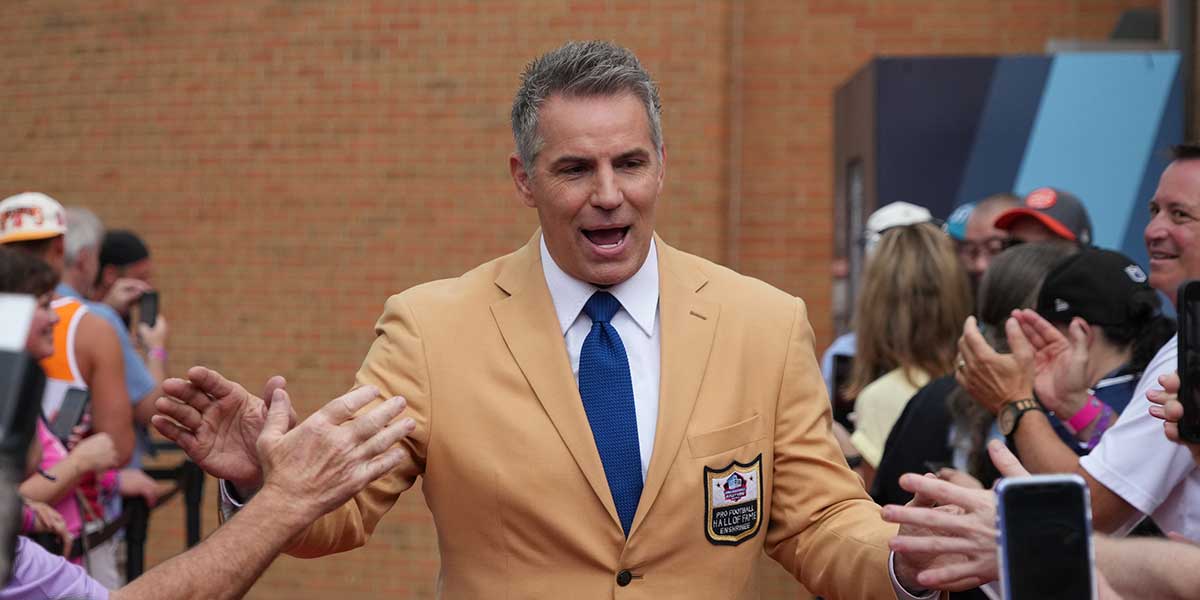 Kurt Warner arrives on the red carpet during the Pro Football Hall of Fame Class of 2022 Enshrinement at Tom Benson Hallof Fame Stadium.