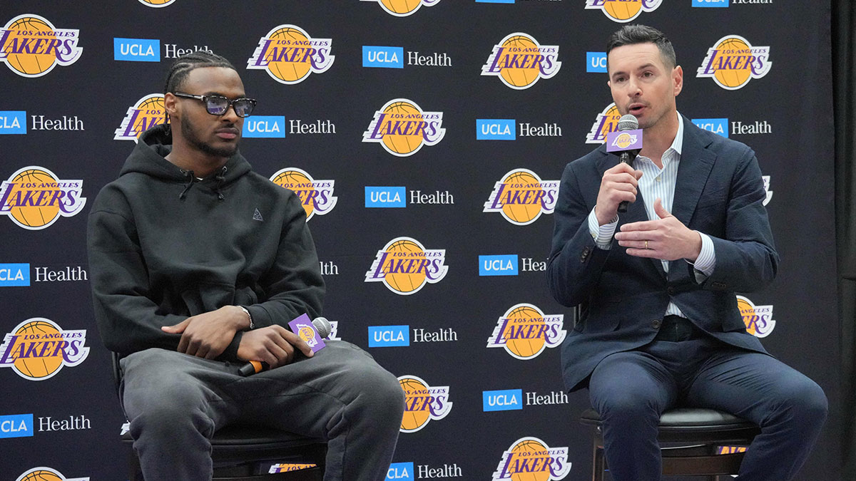 Lakers coach JJ Redick (right) and second-round draft pick Bronny James at a press conference at the UCLA Health Training Center