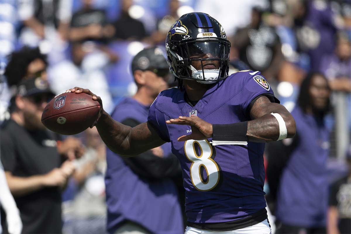 Baltimore Ravens quarterback Lamar Jackson (8) throws before the game against the Las Vegas Raiders at M&T Bank Stadium.