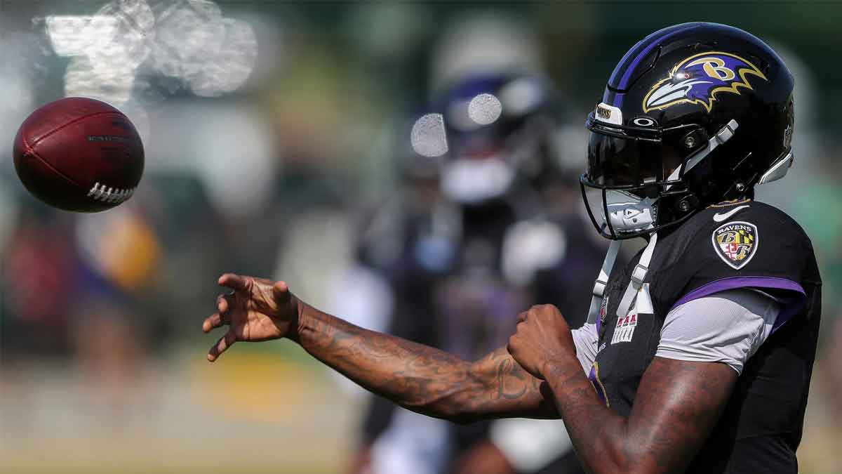 Lamar Jackson throwing the ball at practice Ravens