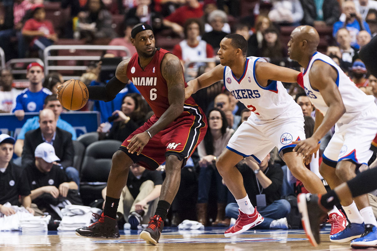 Miami Heat forward LeBron James (6) is defended by Philadelphia 76ers guard Evan Turner (12) during the first quarter at the Wells Fargo Center.