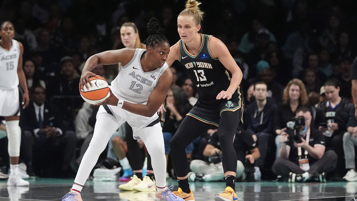 Las Vegas Aces guard Chelsea Gray (12) controls the ball against New York Liberty forward Leonie Fiebich (13) during game one of the 2024 WNBA Semi-finals at Barclays Center.