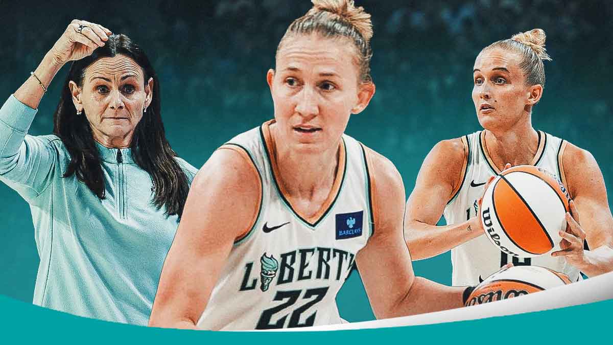 Courtney Vandersloot (Liberty) handling the ball. Liberty coach Sandy Brondello and Leonie Fiebich (Liberty) behind her, Barclays Center background