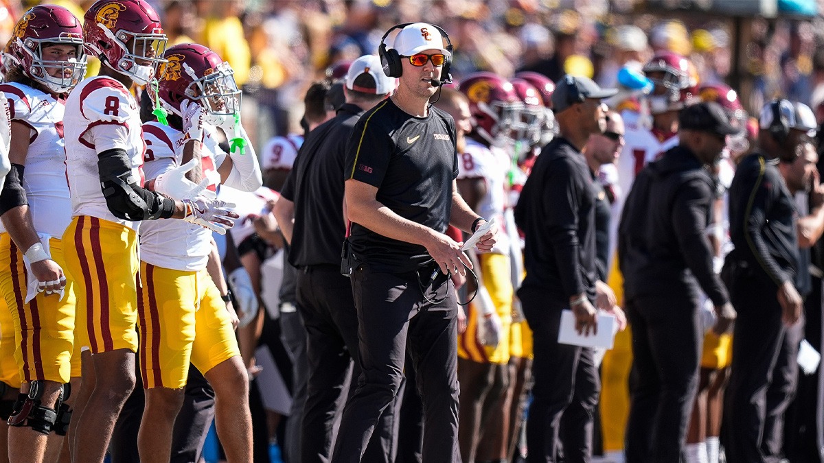 Michigan head coach Sherrone Moore shakes hands with USC head coach Lincoln Riley after 27-24 win at Michigan Stadium in Ann Arbor on Saturday, Sept. 21, 2024.