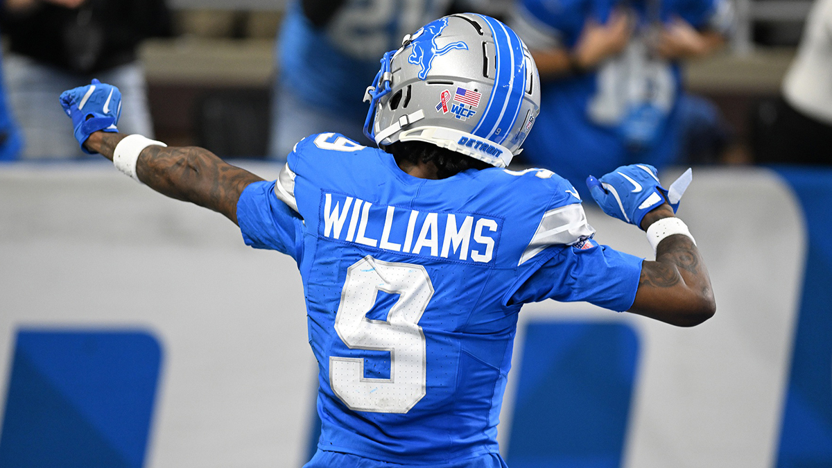 Detroit Lions wide receiver Jameson Williams (9) celebrates in front of the fans after catching a touchdown pass against the Los Angeles Rams in the third quarter at Ford Field.