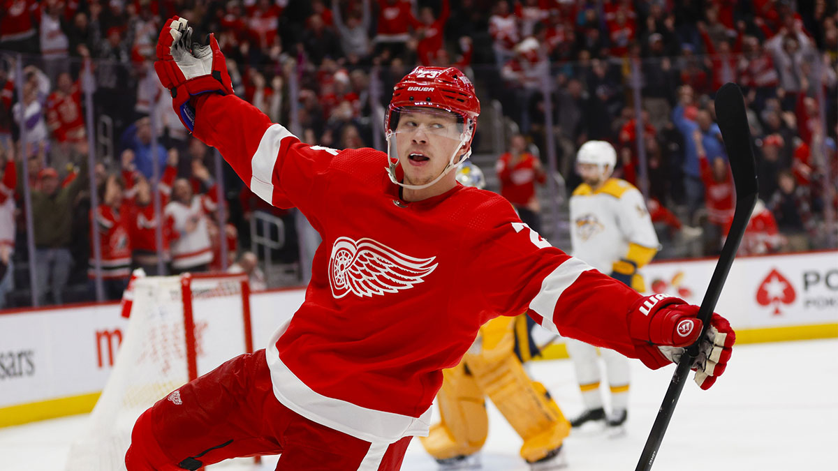 Detroit Red Wings left winger Lucas Raymond (23) celebrates his game-winning shot during overtime of the Detroit Red Wings' game against the Nashville Predators at Little Caesars Arena.