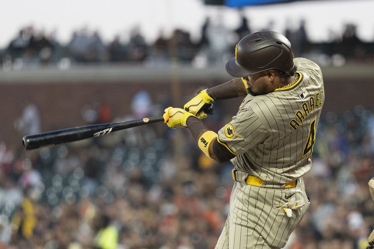 San Diego Padres first base Luis Arraez (4) hits a single during the first inning against the San Francisco Giants at Oracle Park.