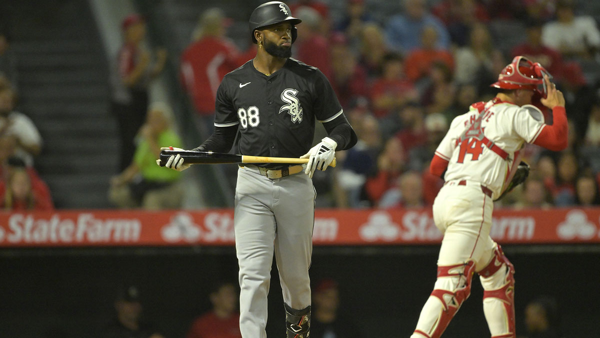 Chicago White Sox center fielder Luis Robert Jr. (88) returns to the dugout after striking out, leaving two runners on base, in the eighth inning against the Los Angeles Angels at Angel Stadium.
