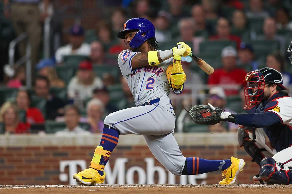 New York Mets shortstop Luisangel Acuna (2) hits a single against the Atlanta Braves in the eighth inning at Truist Park.