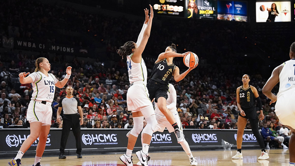 Lynx's Napheesa Collier defends against Aces' Kelsey Plum with Aces' A'ja Wilson looking on