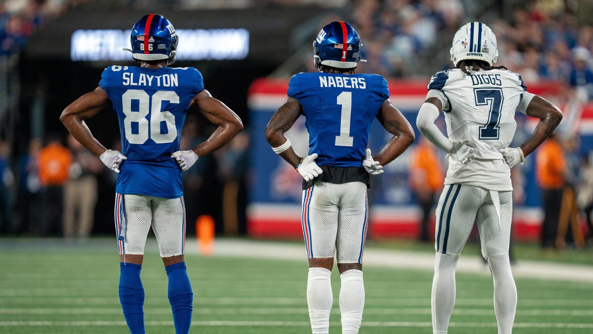 New York Giants wide receiver Darius Slayton (86), New York Giants wide receiver Malik Nabors (1), and Dallas Cowboys cornerback Trevon Diggs (7) stand in a line on the field at MetLife Stadium.