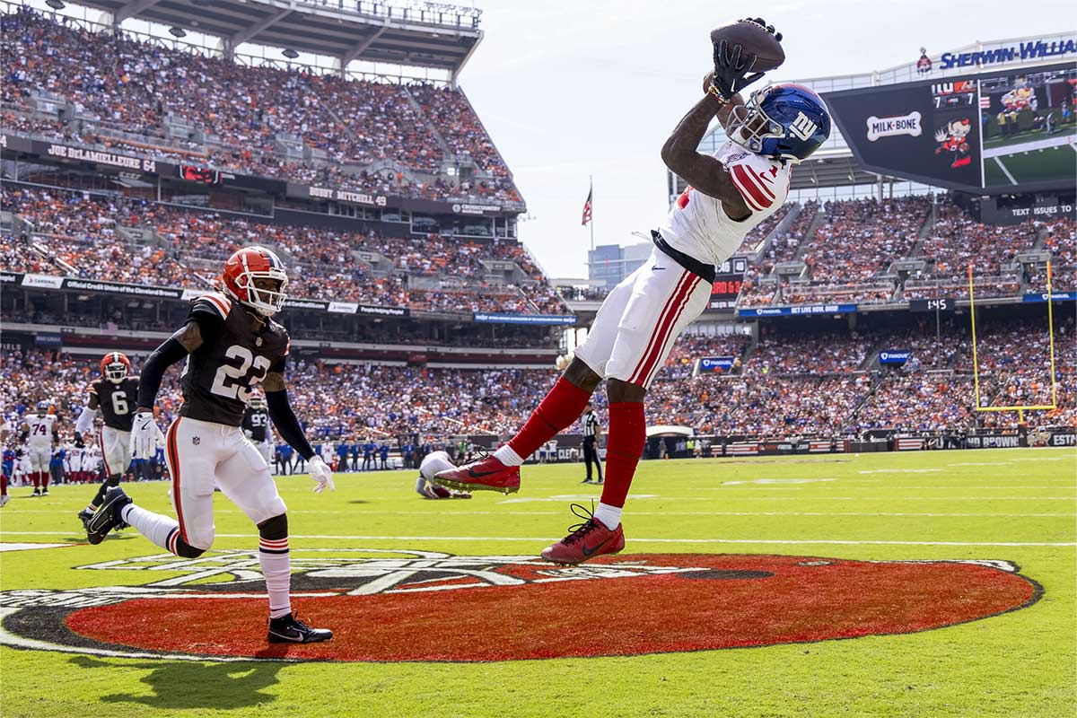 Sep 22, 2024; Cleveland, Ohio, USA; New York Giants wide receiver Malik Nabers (1) makes a touchdown reception under coverage by Cleveland Browns cornerback Martin Emerson Jr. (23) during the second quarter at Huntington Bank Field.