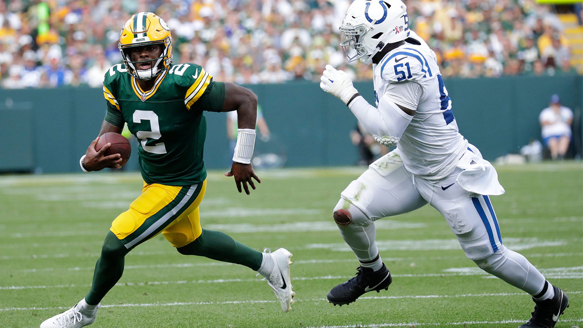 Green Bay Packers quarterback Malik Willis (2) looks for room to run against Indianapolis Colts defensive end Kwity Paye (51) in the third quarter during their football game Sunday, September 15, 2024, at Lambeau Field in Green Bay, Wisconsin.