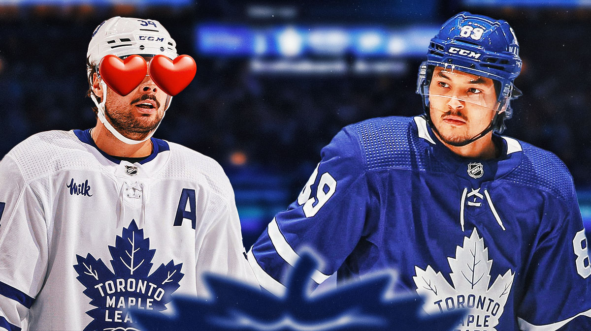 Auston Matthews with heart eyes looking at Nick Robertson