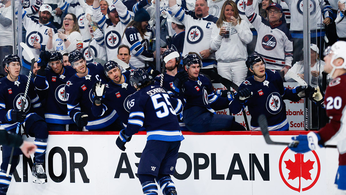 Winnipeg Jets forward Mark Scheifele (55) is congratulated by his teammates on his goal against Colorado Avalanche goalie Alexander Georgiev (not pictured) during the second period in game two of the first round of the 2024 Stanley Cup Playoffs at Canada Life Centre.