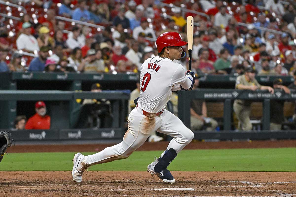 Aug 28, 2024; St. Louis, Missouri, USA; St. Louis Cardinals shortstop Masyn Winn (0) hits a single against the San Diego Padres during the ninth inning at Busch Stadium.