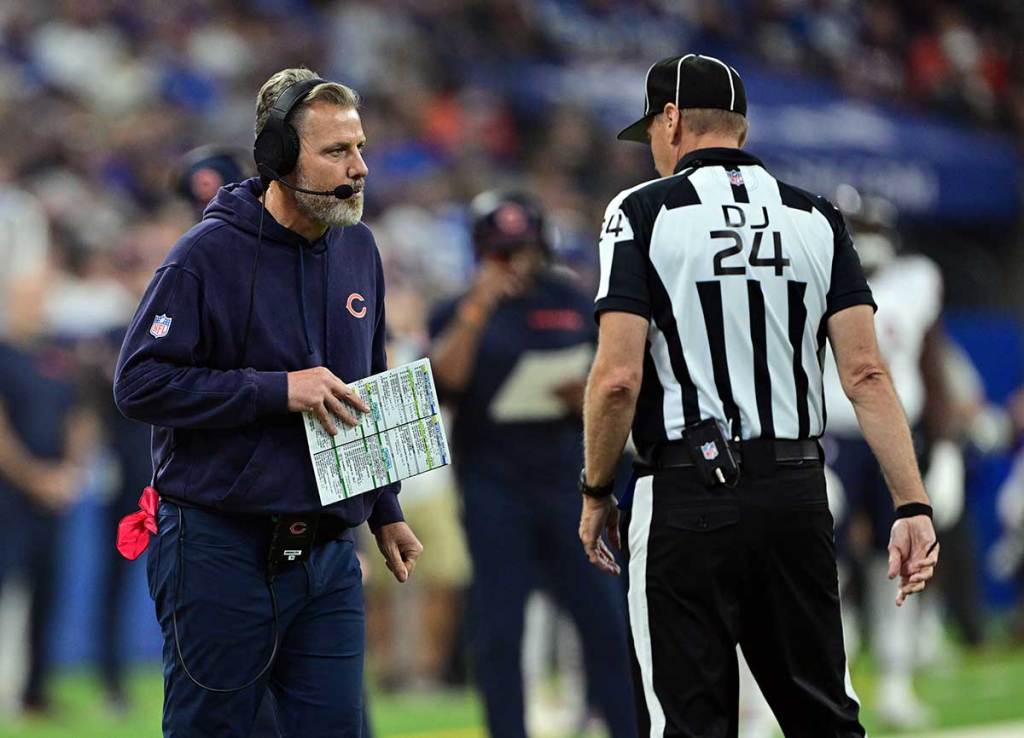Chicago Bears head coach Matt Eberflus has a moment with a referee during the first quarter against the Indianapolis Colts at Lucas Oil Stadium.