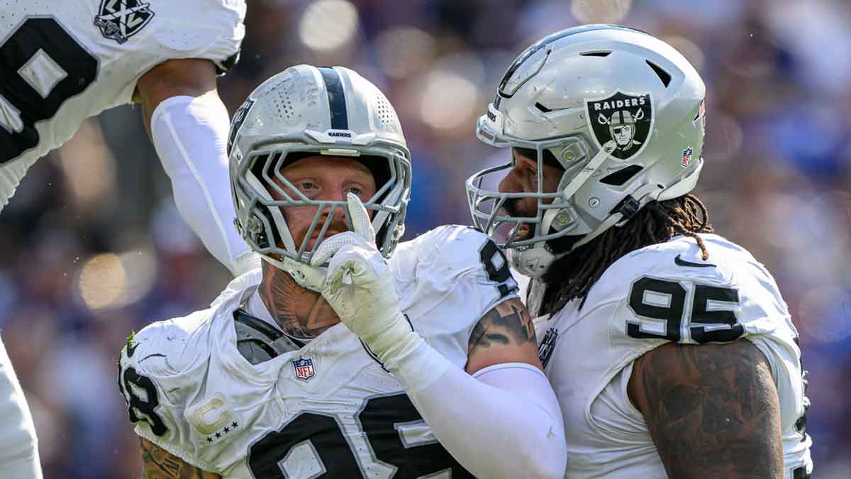 Sep 15, 2024; Baltimore, Maryland, USA; Las Vegas Raiders defensive end Maxx Crosby (98) celebrates with defensive tackle John Jenkins (95) after sacking Baltimore Ravens quarterback Lamar Jackson (not pictured) during the second half at M&T Bank Stadium. 