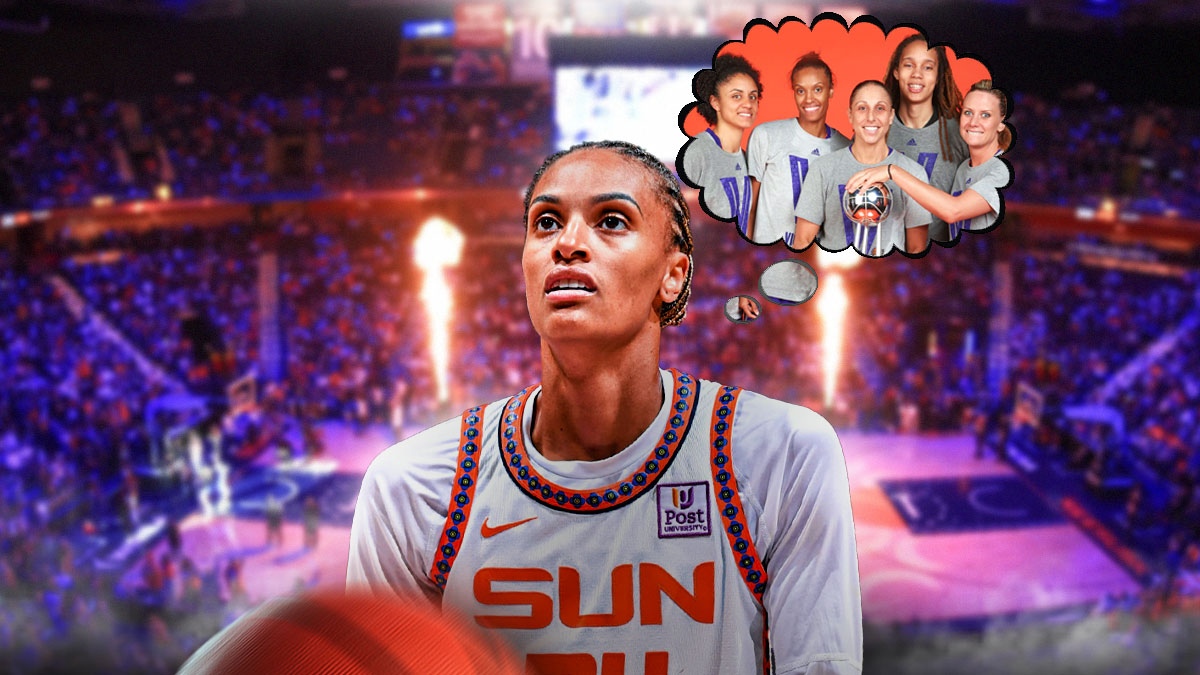 Connecticut Sun forward DeWanna Bonner, with a thought bubble that has a photo of the 2014 Phoenix Mercury full team holding up the WNBA Championship
