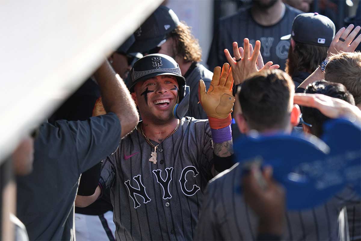 New York Mets catcher Francisco Alvarez (4) celebrates in the dugout after hitting a home run during the second inning against the Philadelphia Phillies at Citi Field.