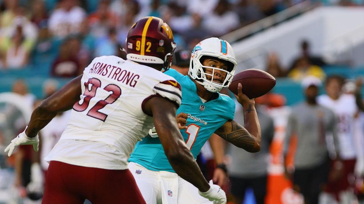 Miami Dolphins quarterback Tua Tagovailoa (1) passes the football against the Washington Commanders during the first quarter of a preseason game at Hard Rock Stadium.