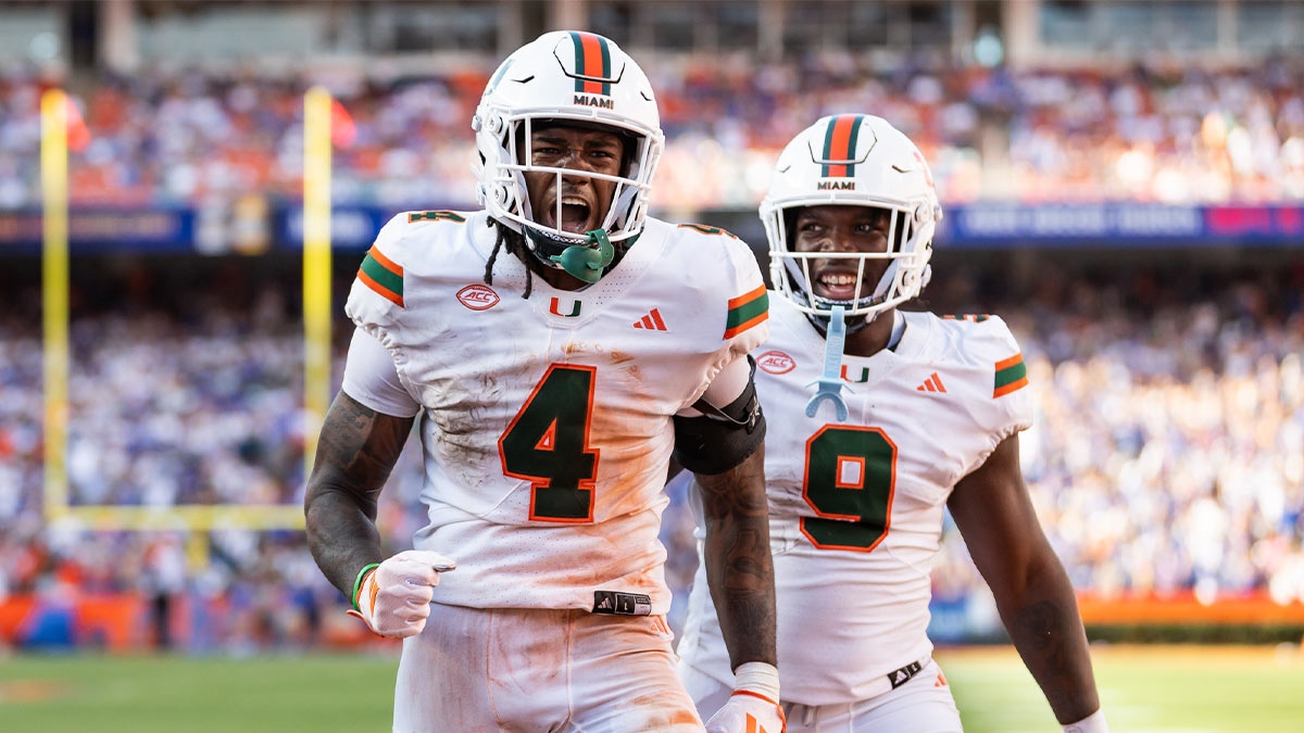 Miami Hurricanes running back Mark Fletcher Jr. (4) and Miami Hurricanes tight end Elija Lofton (9) celebrate after a touchdown against the Florida Gators during the second half at Ben Hill Griffin Stadium.