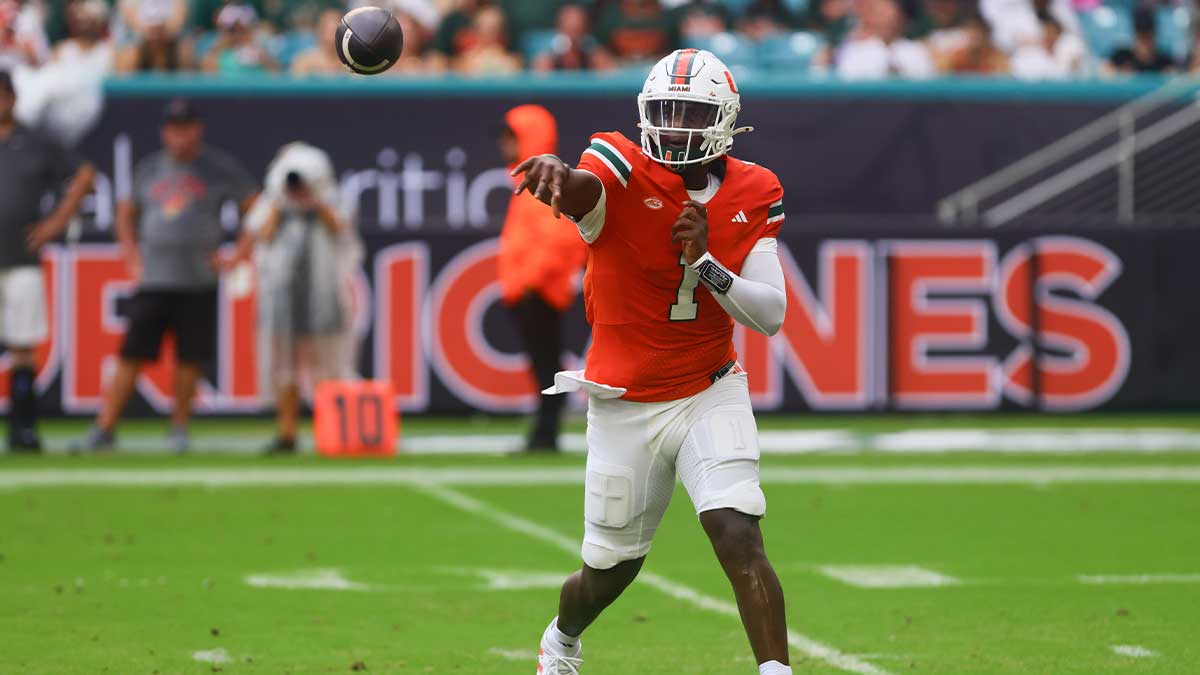 Miami Hurricanes quarterback Cam Ward (1) passes the football against the Ball State Cardinals during the first quarter at Hard Rock Stadium.