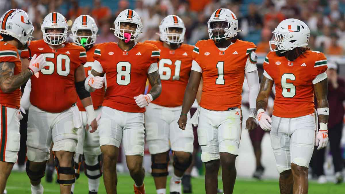 Sep 27, 2024; Miami Gardens, Florida, USA; Miami Hurricanes quarterback Cam Ward (1) looks on from the field against the Virginia Tech Hokies during the first quarter at Hard Rock Stadium. Mandatory Credit: Sam Navarro-Imagn Images