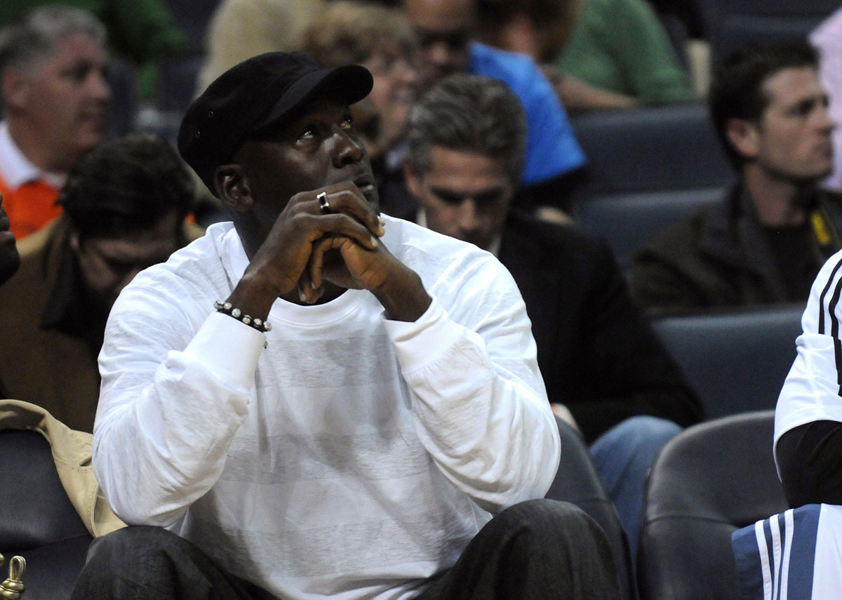 Michael Jordan watches on while playing against the Washington Wizards at Time Warner Cable Arena