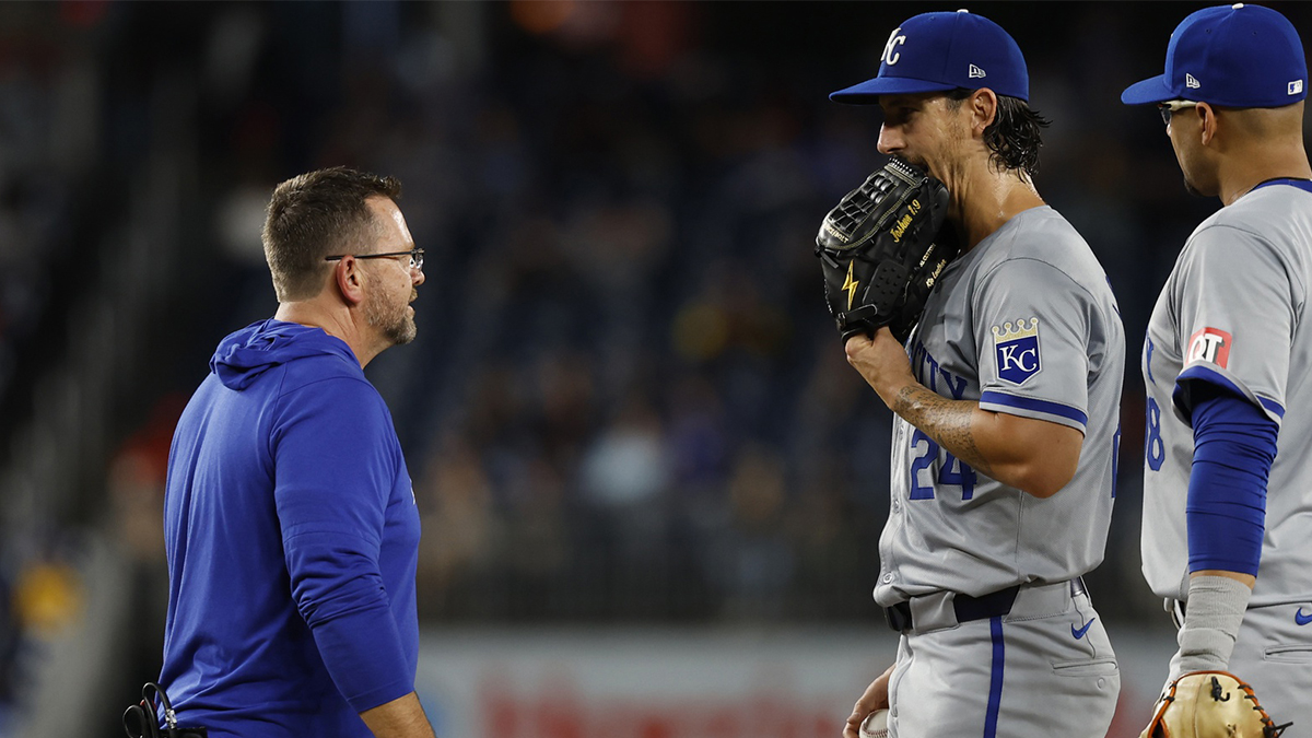Sep 25, 2024; Washington, District of Columbia, USA; Kansas City Royals starting pitcher Michael Lorenzen (24) talks with Royals head athletic trainer Kyle Turner (L) on the mound after an apparent injury against the Washington Nationals during the third inning at Nationals Park. Mandatory Credit: Geoff Burke-Imagn Images