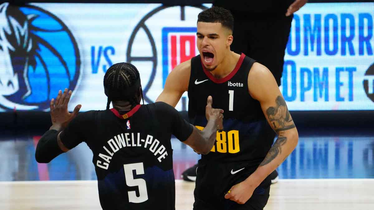 Denver Nuggets forward Michael Porter Jr. (1) and guard Kentavious Caldwell-Pope (5) celebrate a score in the second half against the Los Angeles Lakers during game two during the 2024 NBA playoffs at Ball Arena.