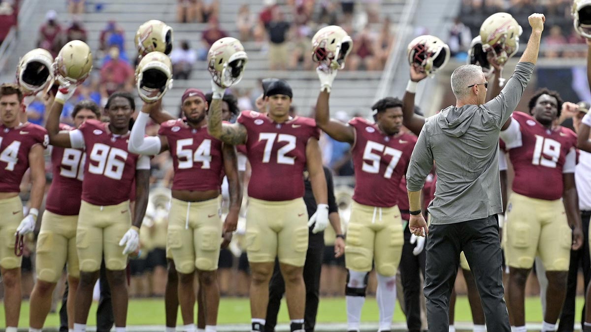 Florida State Seminoles head coach Mike Norvell leads his team before a game against the Memphis Tigers at Doak S. Campbell Stadium.