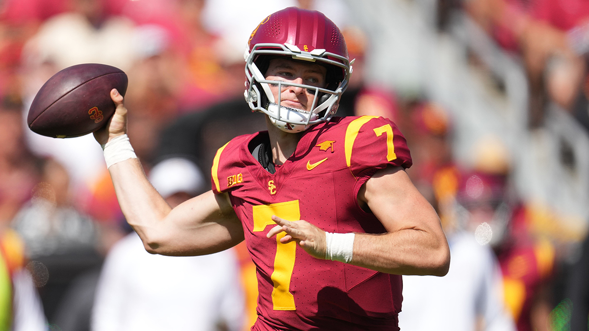 Sep 28, 2024; Los Angeles, California, USA; Southern California Trojans quarterback Miller Moss (7) throws the ball against the Wisconsin Badgers in the first half at United Airlines Field at Los Angeles Memorial Coliseum.